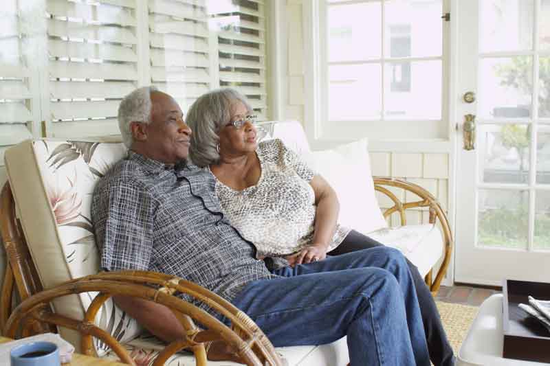 elder couple looking onward after pre need planning with funeral home