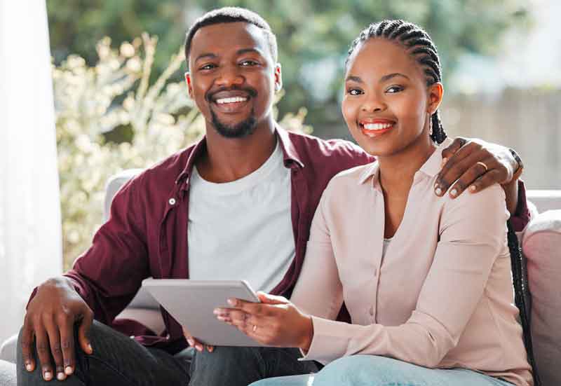 young couple reading funeral planning guide